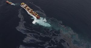 Bad weather hinders oil spill salvage from stricken ship off New Zealand